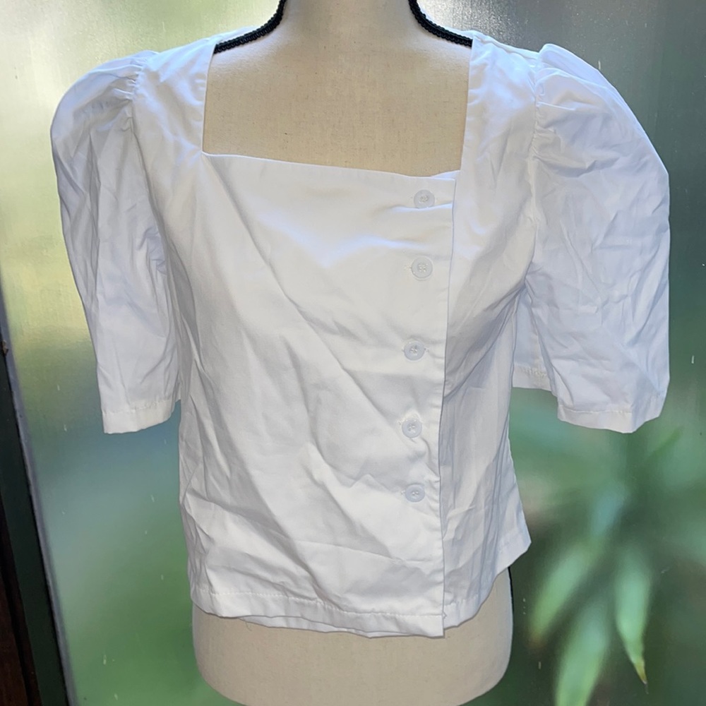 Only one brand.  Woman’s blouse white one size free style size only